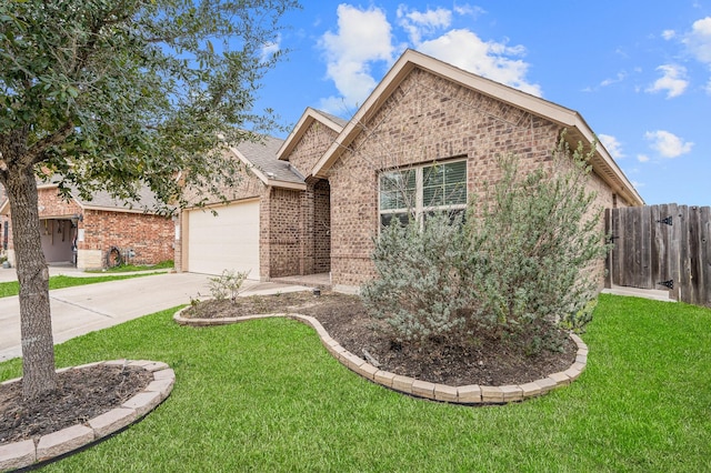 view of front of house with a garage and a front yard