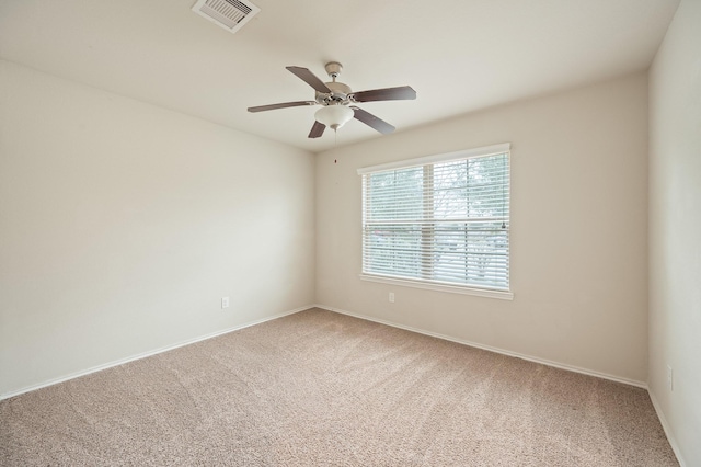 spare room with carpet and ceiling fan