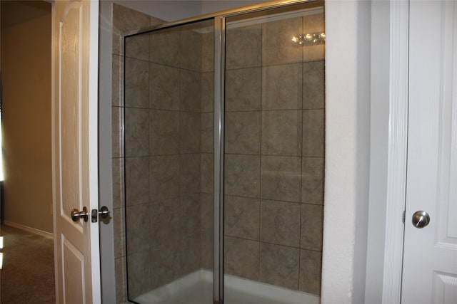 bathroom featuring an enclosed shower