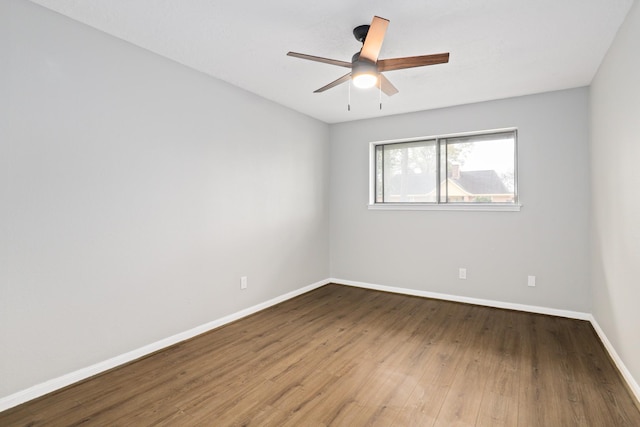 unfurnished room featuring ceiling fan and hardwood / wood-style floors