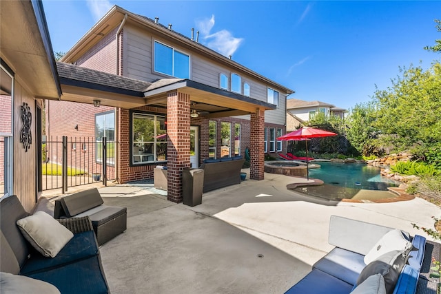 back of house featuring a patio area and outdoor lounge area