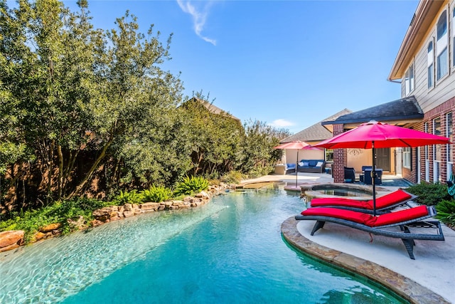 view of pool featuring an in ground hot tub and a patio