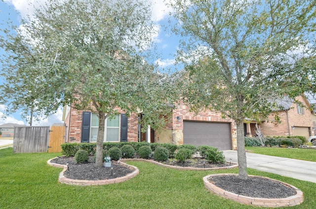 view of property hidden behind natural elements with a garage, brick siding, a front yard, a gate, and concrete driveway