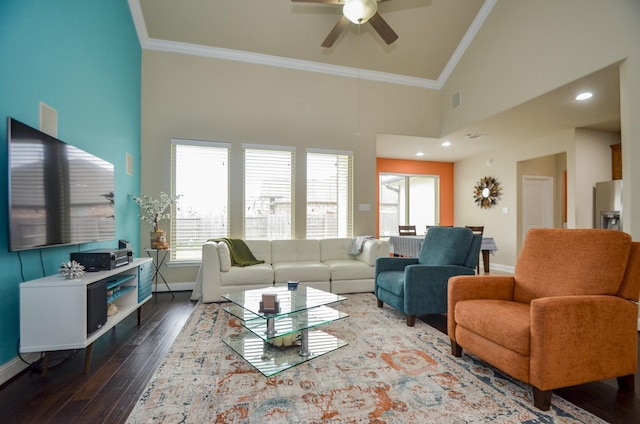 living room with crown molding, dark wood-type flooring, high vaulted ceiling, and ceiling fan