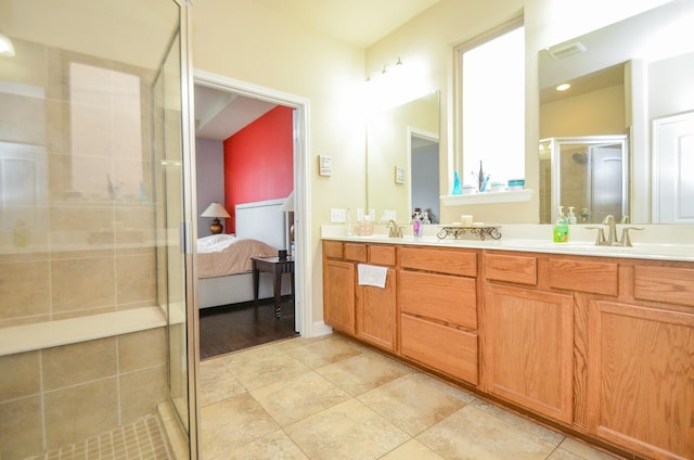 bathroom featuring a sink, double vanity, connected bathroom, and a stall shower