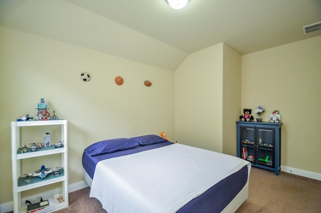 bedroom featuring carpet flooring, baseboards, lofted ceiling, and visible vents