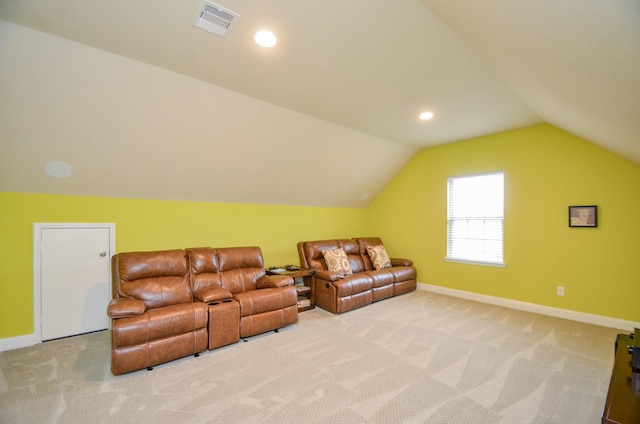 carpeted living room with lofted ceiling