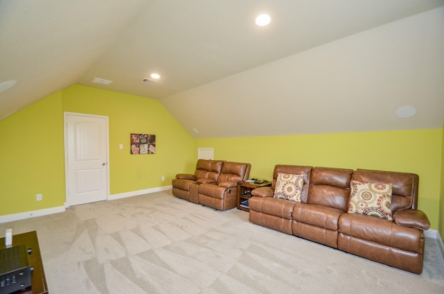 carpeted living room featuring vaulted ceiling