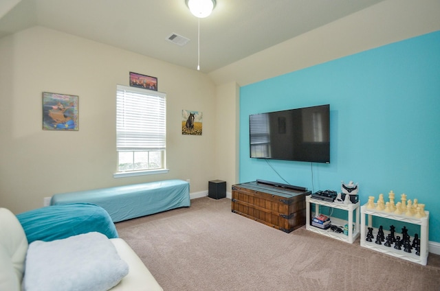 carpeted bedroom featuring vaulted ceiling