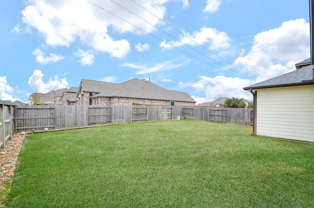 view of yard with a fenced backyard