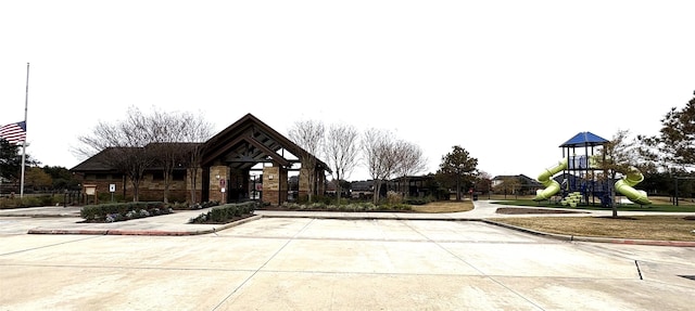 view of home's community featuring playground community
