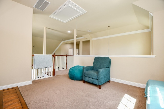 living area featuring attic access, carpet floors, visible vents, and baseboards