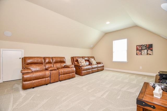 carpeted living room featuring vaulted ceiling and baseboards
