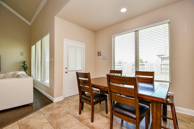 dining room featuring light tile patterned floors, baseboards, recessed lighting, and ornamental molding