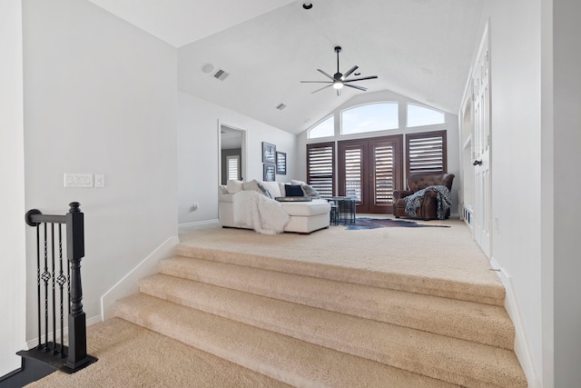 interior space featuring carpet flooring, vaulted ceiling, and ceiling fan