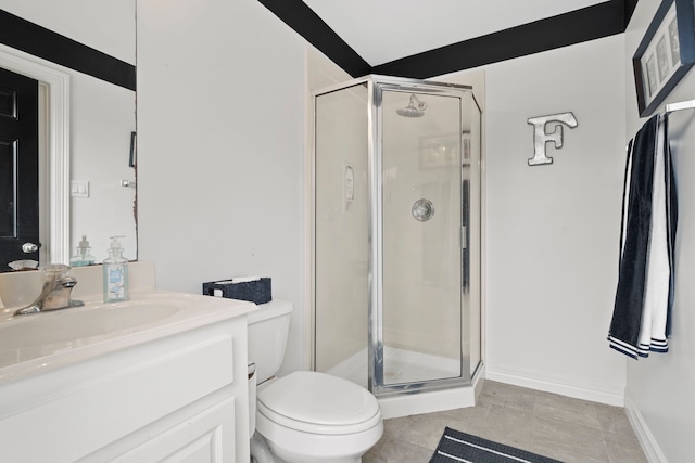 bathroom with a shower with shower door, tile patterned floors, toilet, and vanity