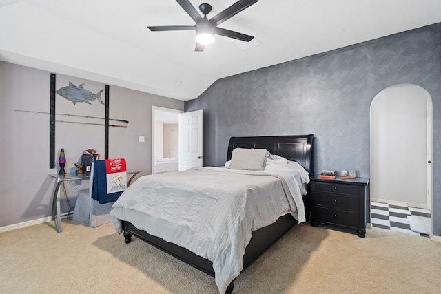 carpeted bedroom featuring lofted ceiling and ceiling fan