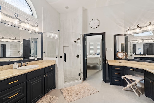 bathroom featuring a high ceiling, tile patterned flooring, walk in shower, and vanity