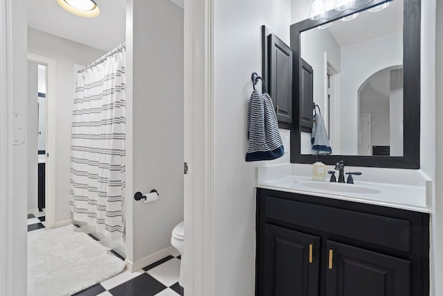 bathroom with toilet and vanity