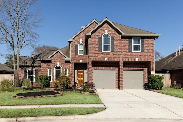 view of front property featuring a garage and a front yard