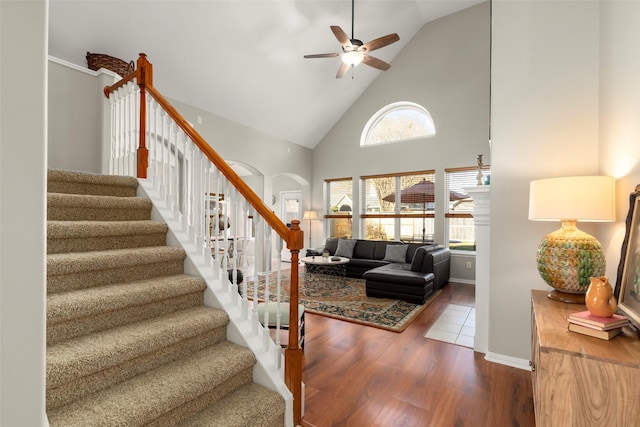 interior space with ceiling fan, hardwood / wood-style floors, and high vaulted ceiling