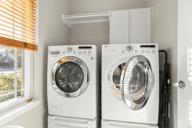 washroom featuring washer and clothes dryer