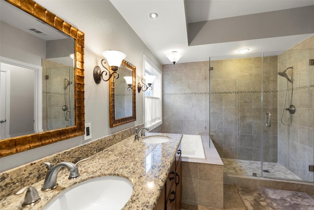 bathroom featuring vanity and plus walk in shower