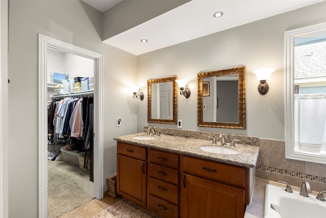 bathroom with vanity and a bathtub