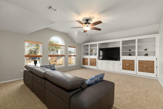 living room featuring lofted ceiling, light colored carpet, and ceiling fan