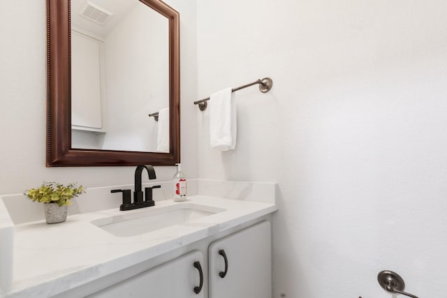 bathroom featuring vanity and visible vents