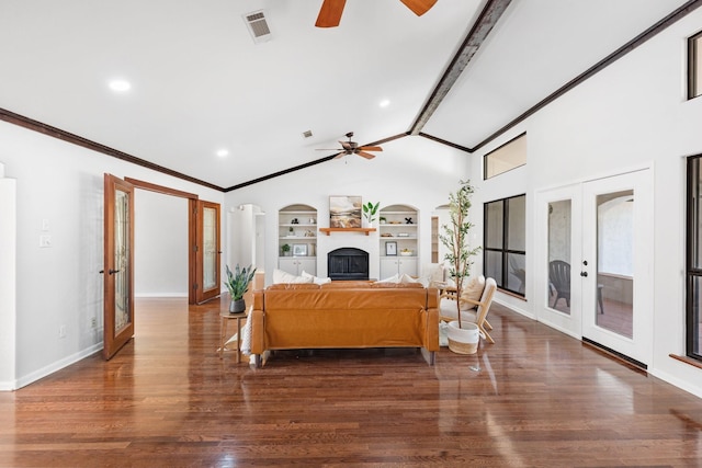 living room with built in features, french doors, dark wood-type flooring, and vaulted ceiling with beams