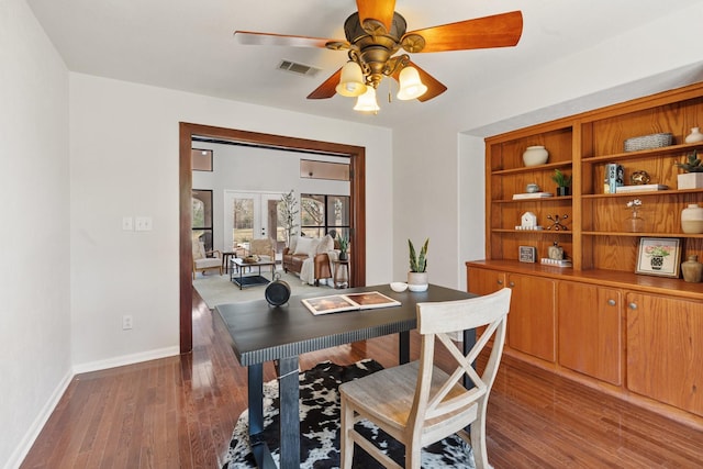 office area with ceiling fan, french doors, and dark wood-type flooring