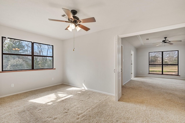 unfurnished room featuring carpet flooring, ceiling fan, visible vents, and baseboards