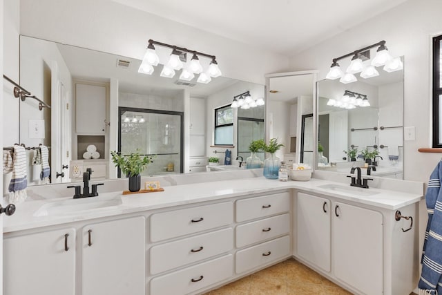 bathroom featuring vanity, tile patterned flooring, and an enclosed shower