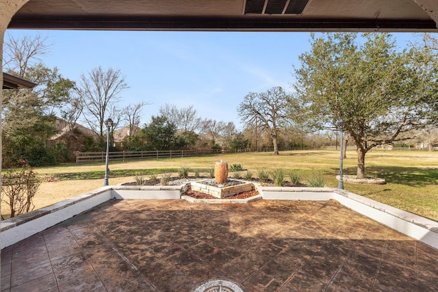 view of yard with a rural view