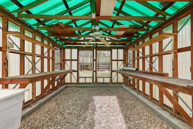 unfurnished sunroom featuring vaulted ceiling