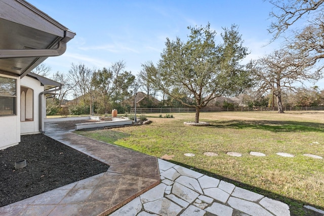 view of yard featuring a patio area and fence