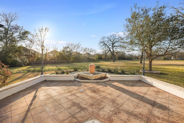 view of patio featuring fence