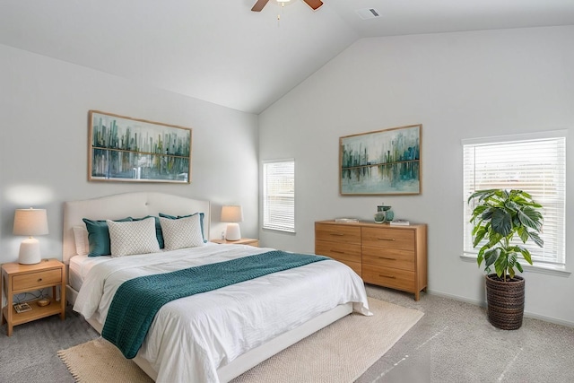 carpeted bedroom with vaulted ceiling and ceiling fan