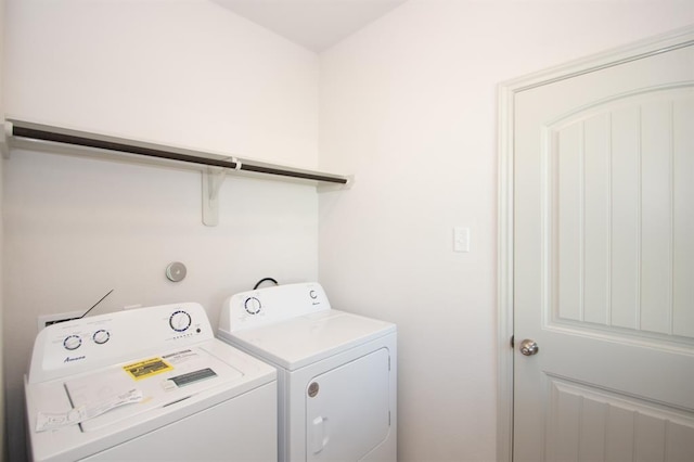 laundry room featuring washing machine and dryer