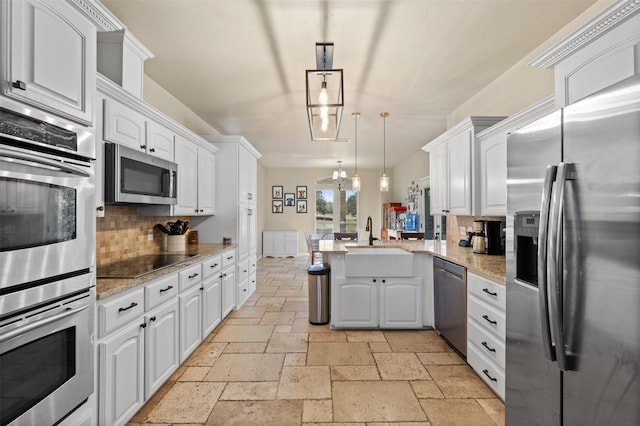 kitchen featuring pendant lighting, white cabinetry, and appliances with stainless steel finishes