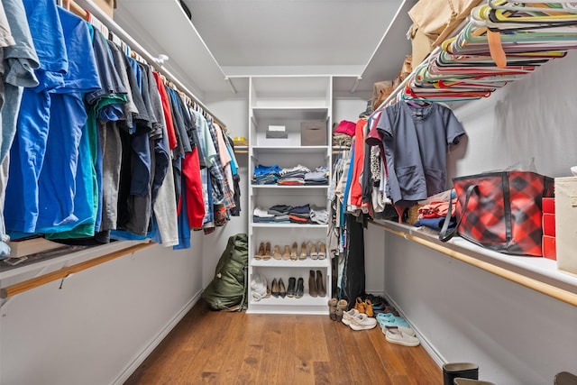 spacious closet featuring hardwood / wood-style floors