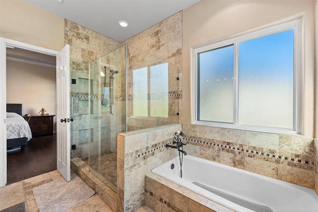 bathroom with separate shower and tub