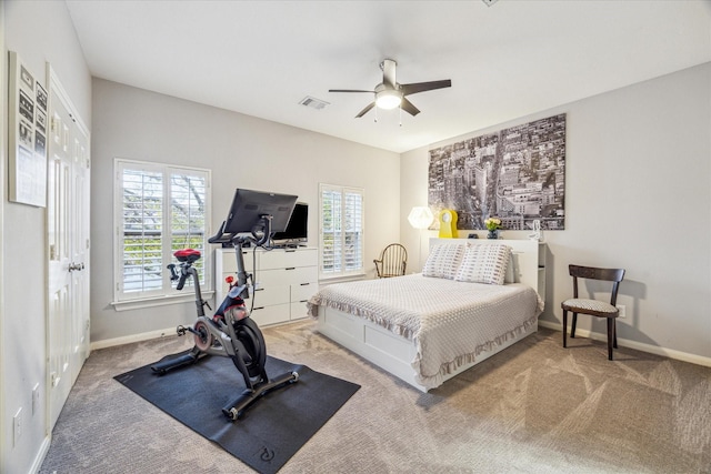 carpeted bedroom with ceiling fan