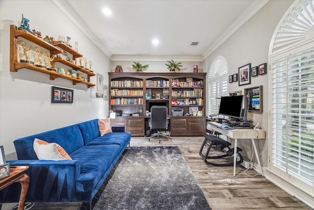 office featuring hardwood / wood-style flooring and crown molding