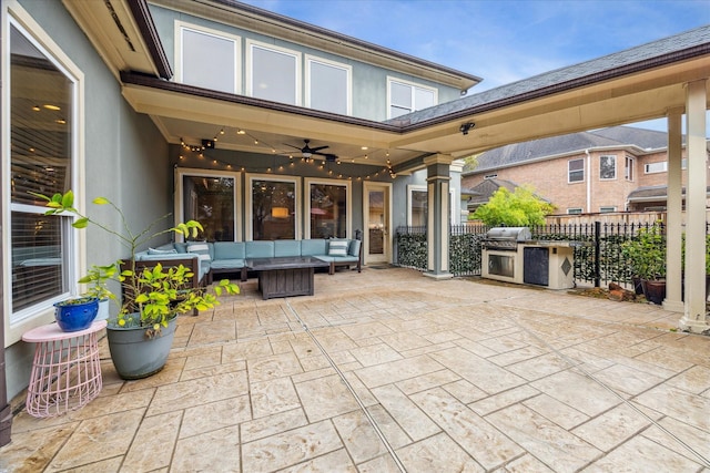 view of patio featuring a grill, an outdoor kitchen, outdoor lounge area, and ceiling fan