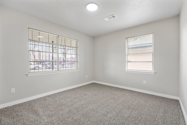 empty room featuring carpet floors