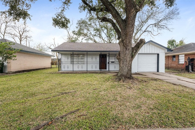 single story home with a front lawn and a garage