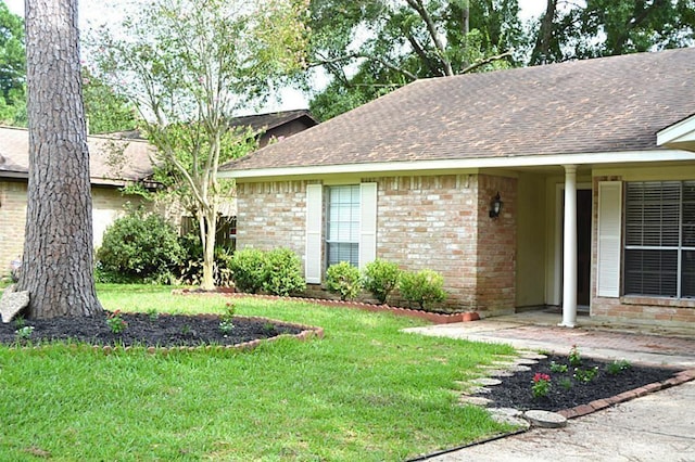 exterior space with a front lawn