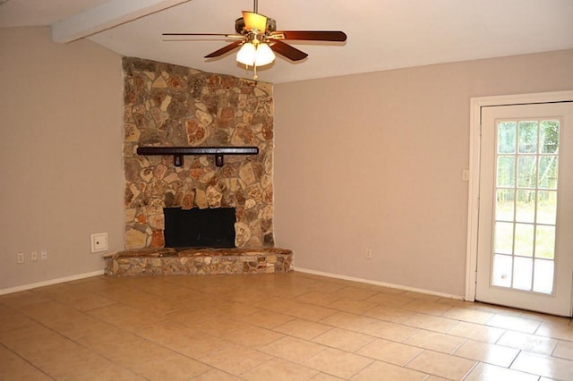 unfurnished living room featuring ceiling fan, light tile patterned floors, a stone fireplace, and vaulted ceiling with beams